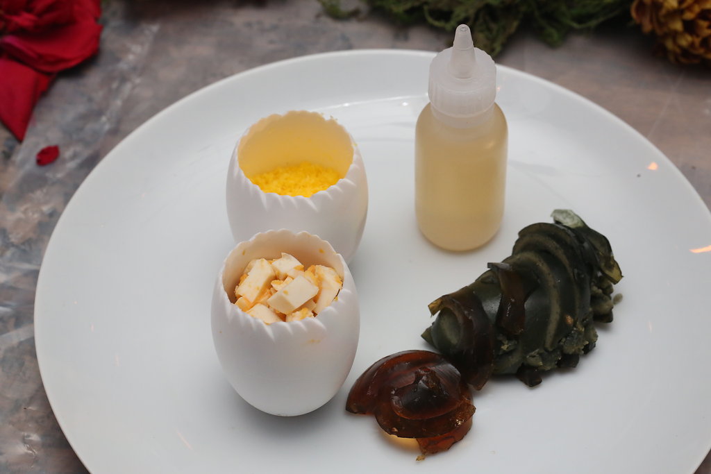 Salted duck egg and century egg toppings for the soup course -- Image by Marina McClure.
