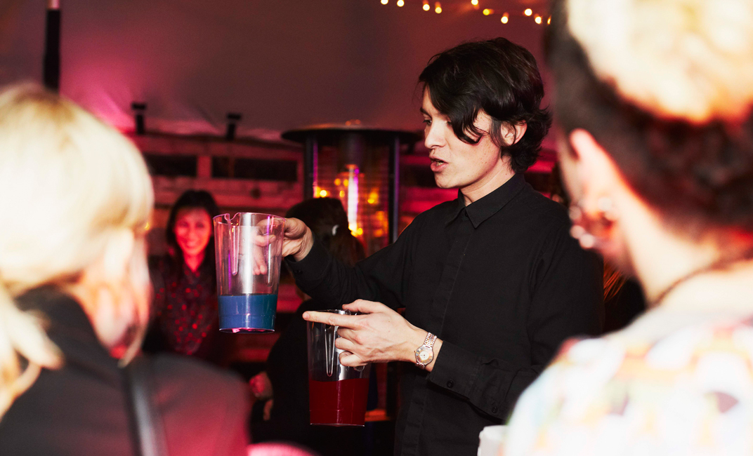 Charles Michel prepares some strange coloured drinks for the audience – Image Rita Platts